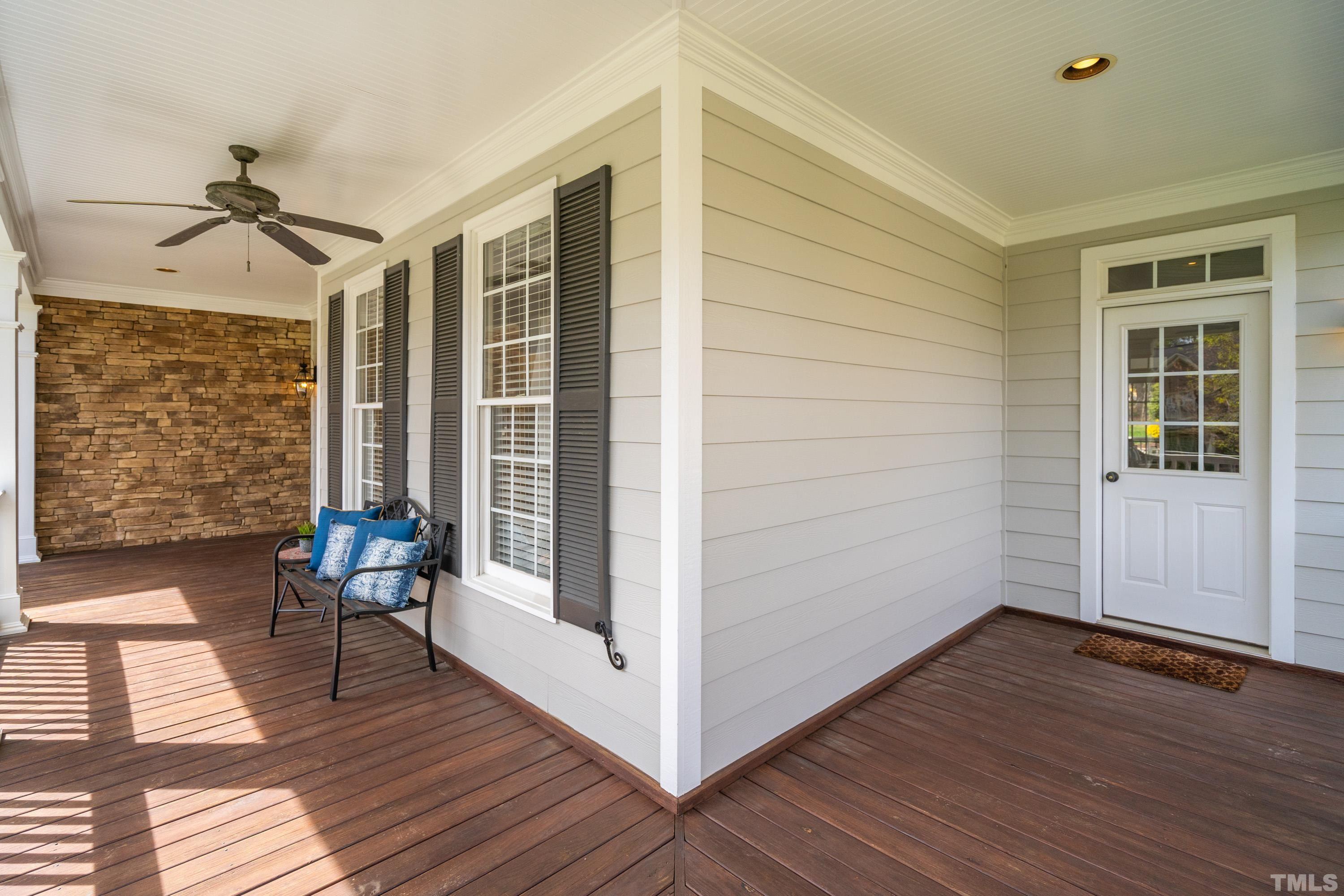 4324 Summer Brook Drive Apex, NC 27539 - Photo 3 of 70 a view of a porch with wooden floor and front door