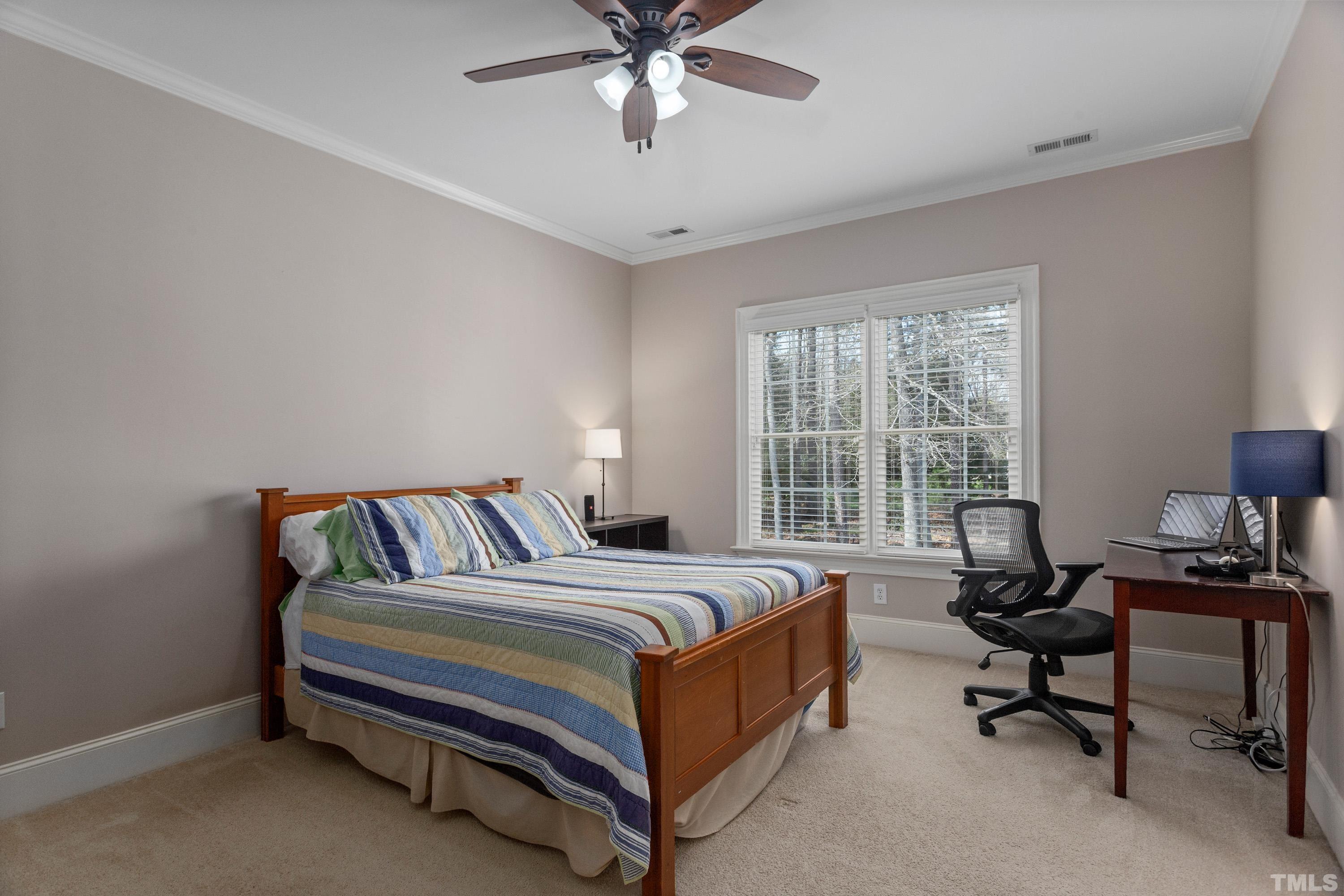 4324 Summer Brook Drive Apex, NC 27539 - Photo 32 of 70 a bed room with a bed and a window