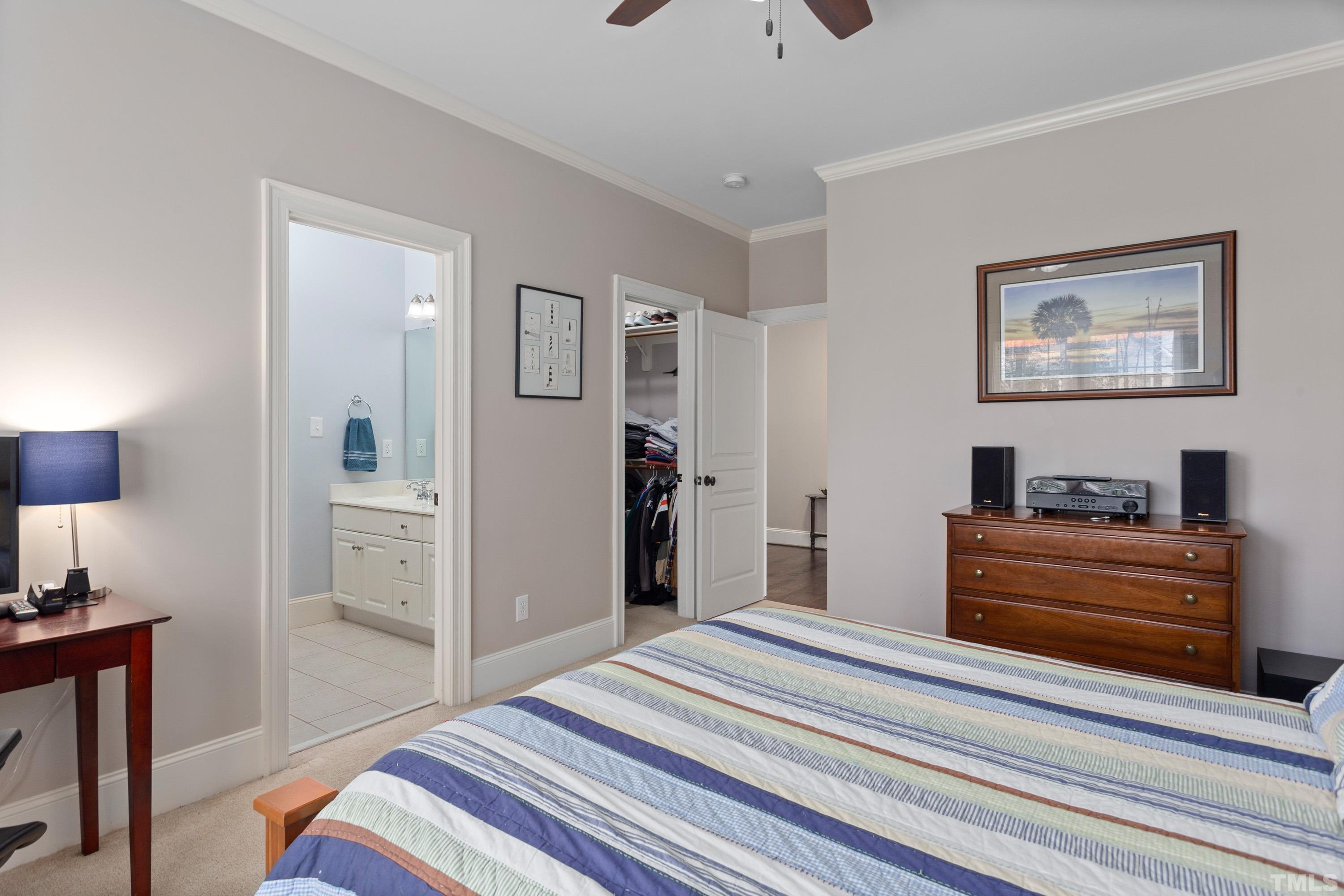 4324 Summer Brook Drive Apex, NC 27539 - Photo 37 of 70 a bedroom with a bed and a dresser