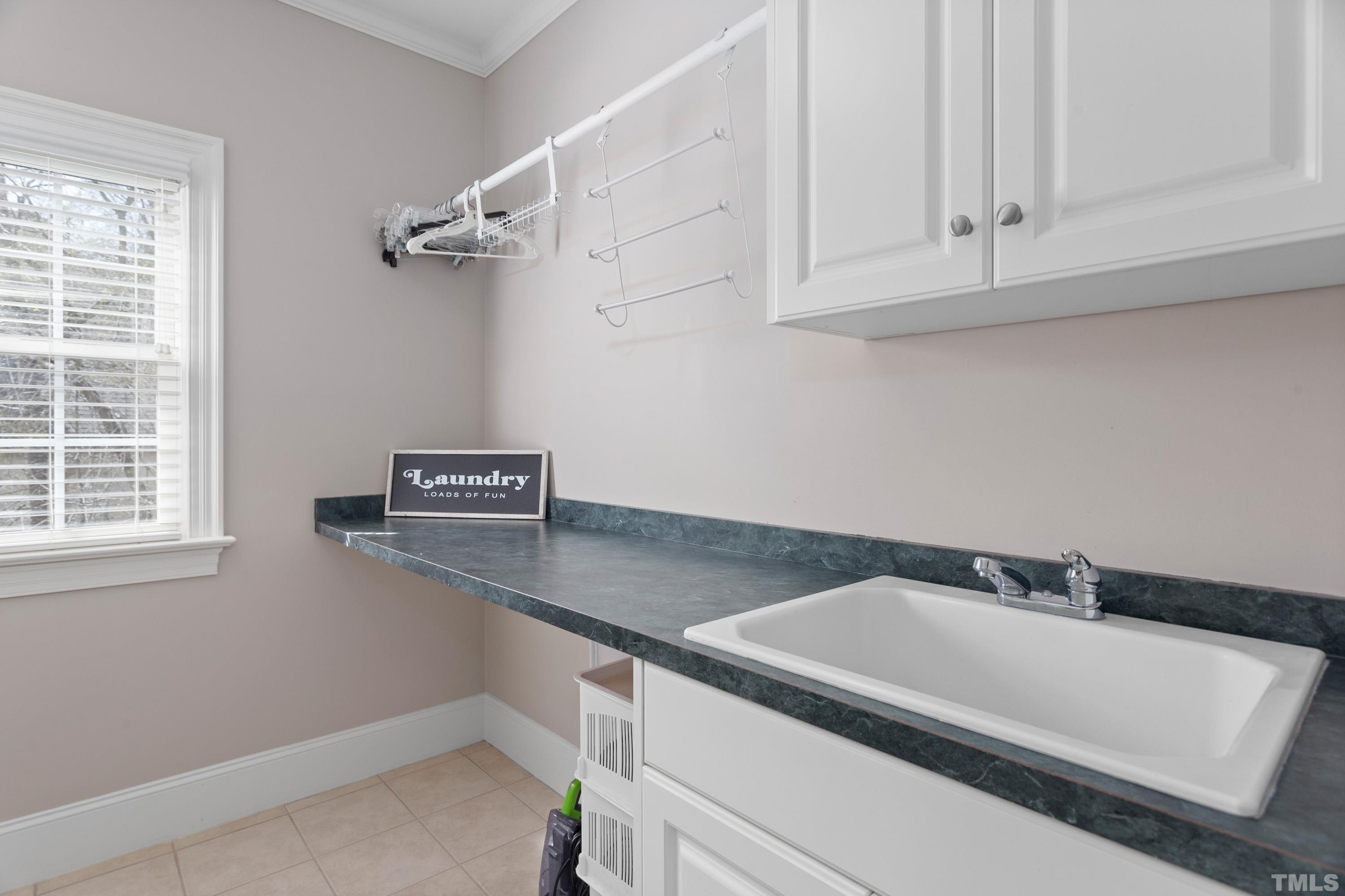 4324 Summer Brook Drive Apex, NC 27539 - Photo 38 of 70 Features a window, folding counter and lots of storage! Washer and dryer stay