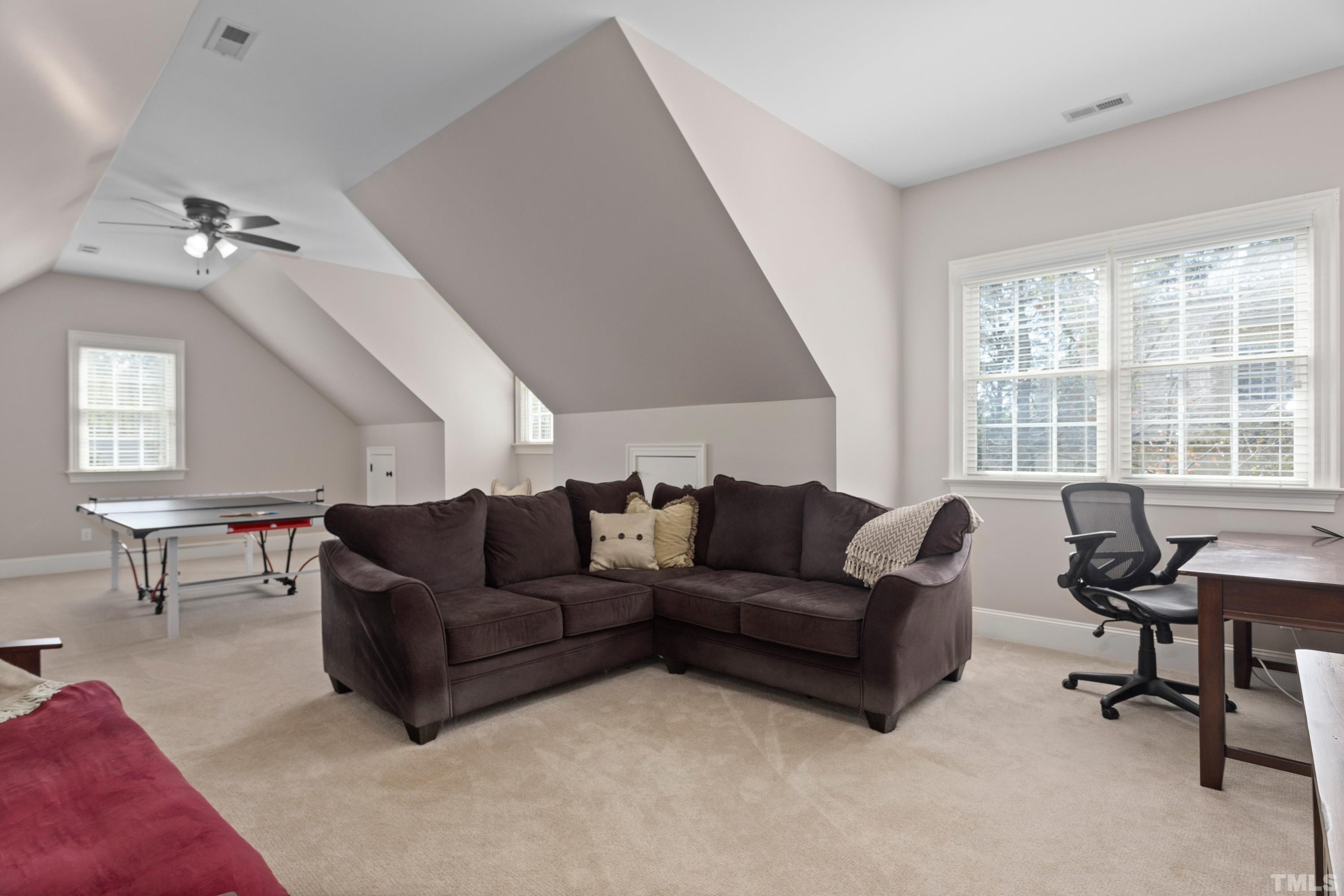 4324 Summer Brook Drive Apex, NC 27539 - Photo 40 of 70 a living room with furniture and a window
