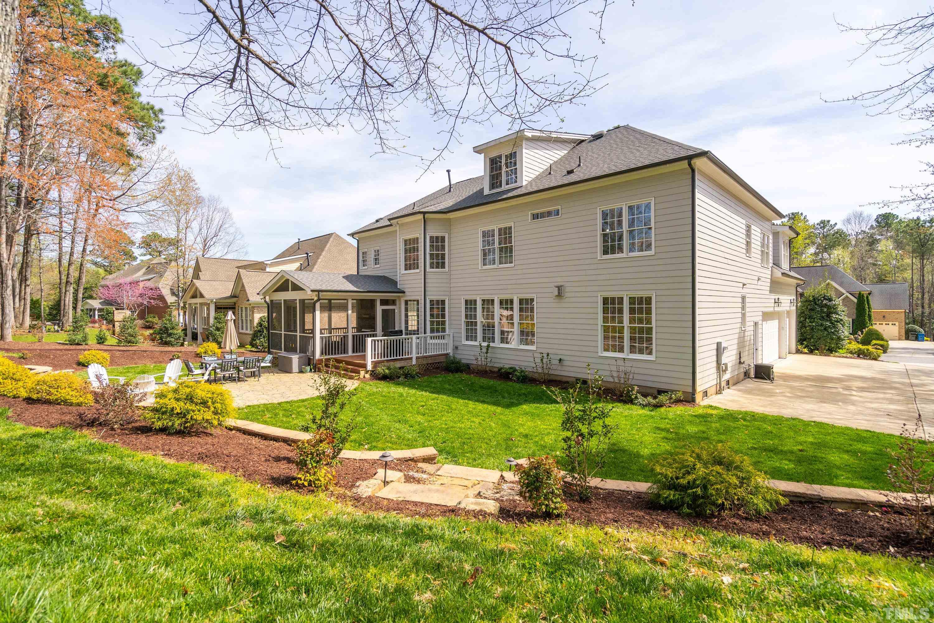 4324 Summer Brook Drive Apex, NC 27539 - Photo 51 of 70 a view of a house with backyard sitting area and garden