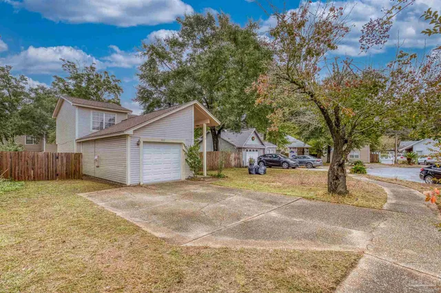 a house with trees in the background