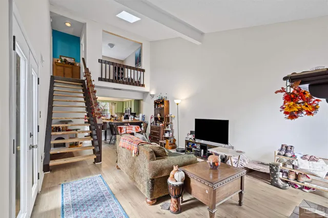 a view of a livingroom with furniture and a flat screen tv