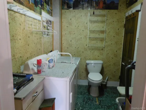 a bathroom with a toilet and shower