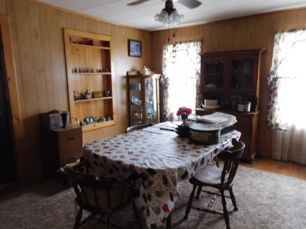 a dining room with furniture and window