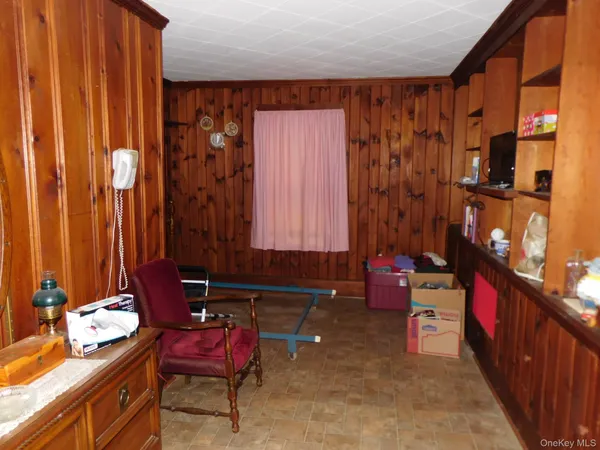 a room with furniture and musical instruments