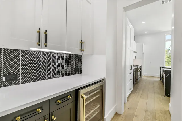 a view of a kitchen from the hallway