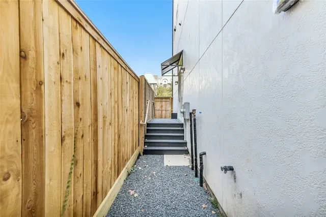 a view of a hallway with stairs