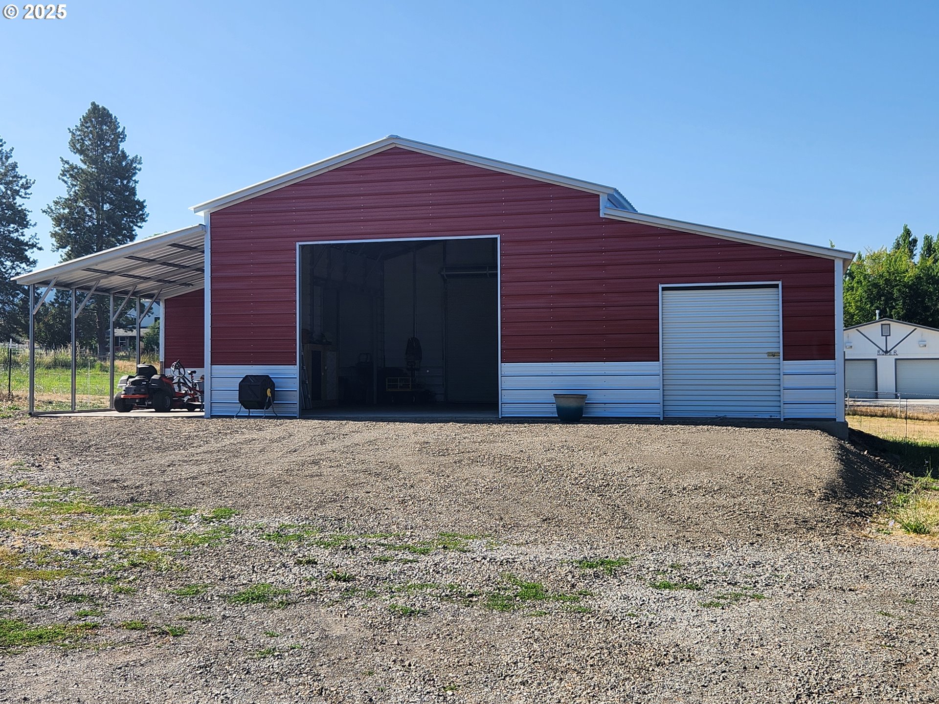 1008 Foster Street Cove, OR 97824 - Photo 3 of 33 a front view of a house with a yard and garage