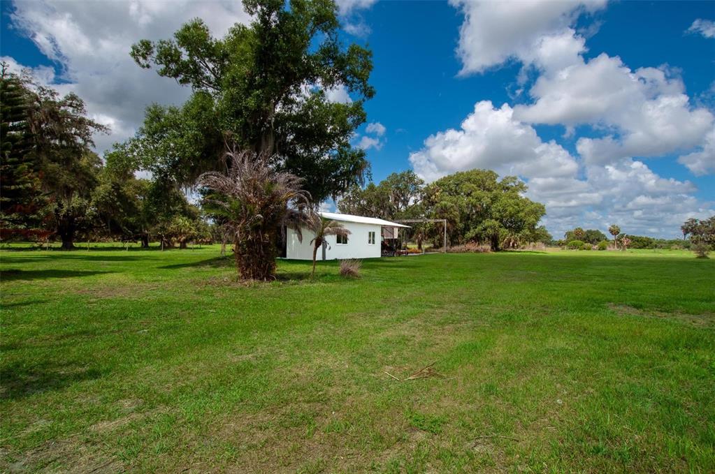 1635 Southwest Rodgers Avenue Arcadia, FL 34266 - Photo 23 of 32 a view of a house with a big yard