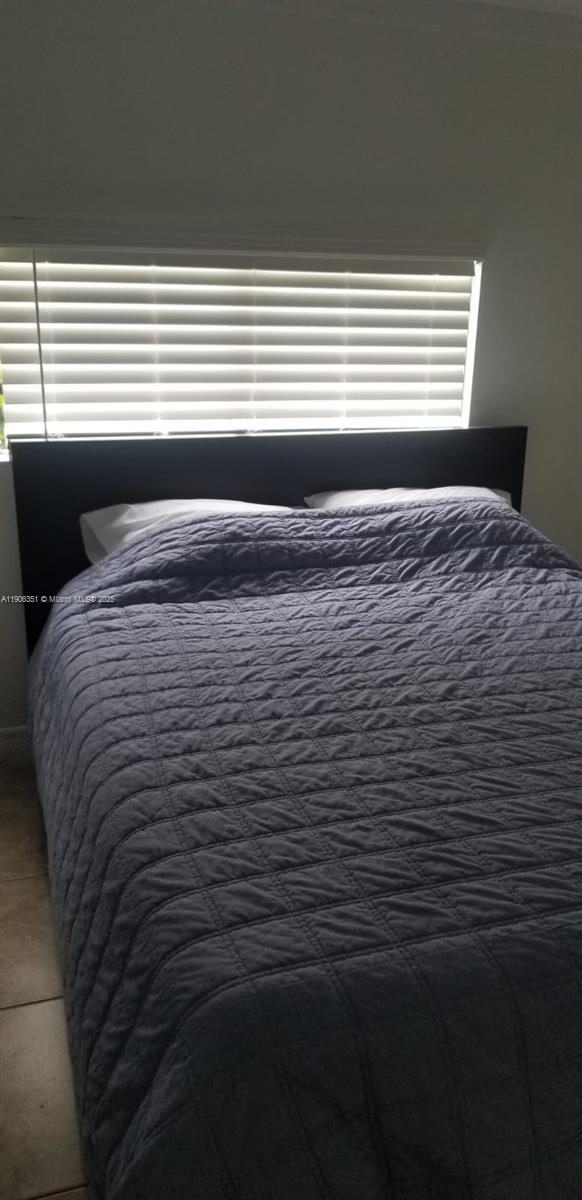 13101 Southwest 14th Street, Unit 1 Miami, FL 33184 - Photo 6 of 12 a view of a room with window