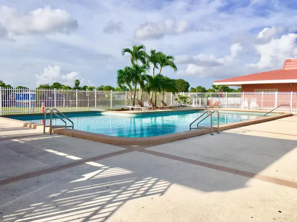 a view of a swimming pool with a patio