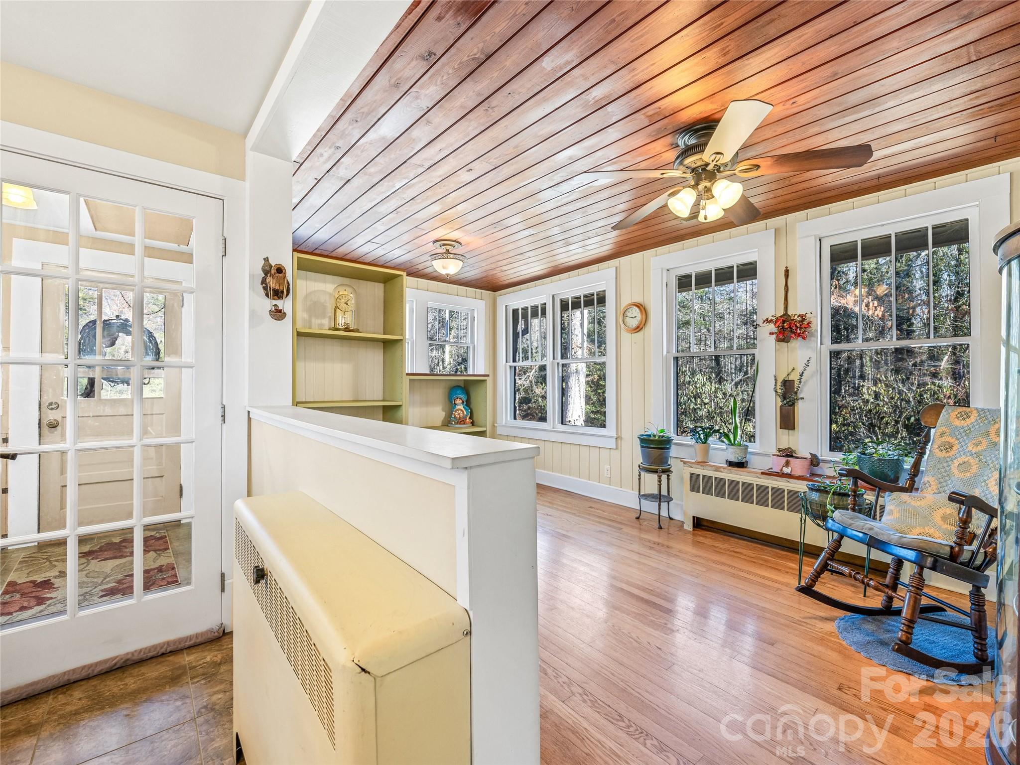 104 Campground Road Hendersonville, NC 28791 - Photo 13 of 32 a kitchen with furniture and large windows