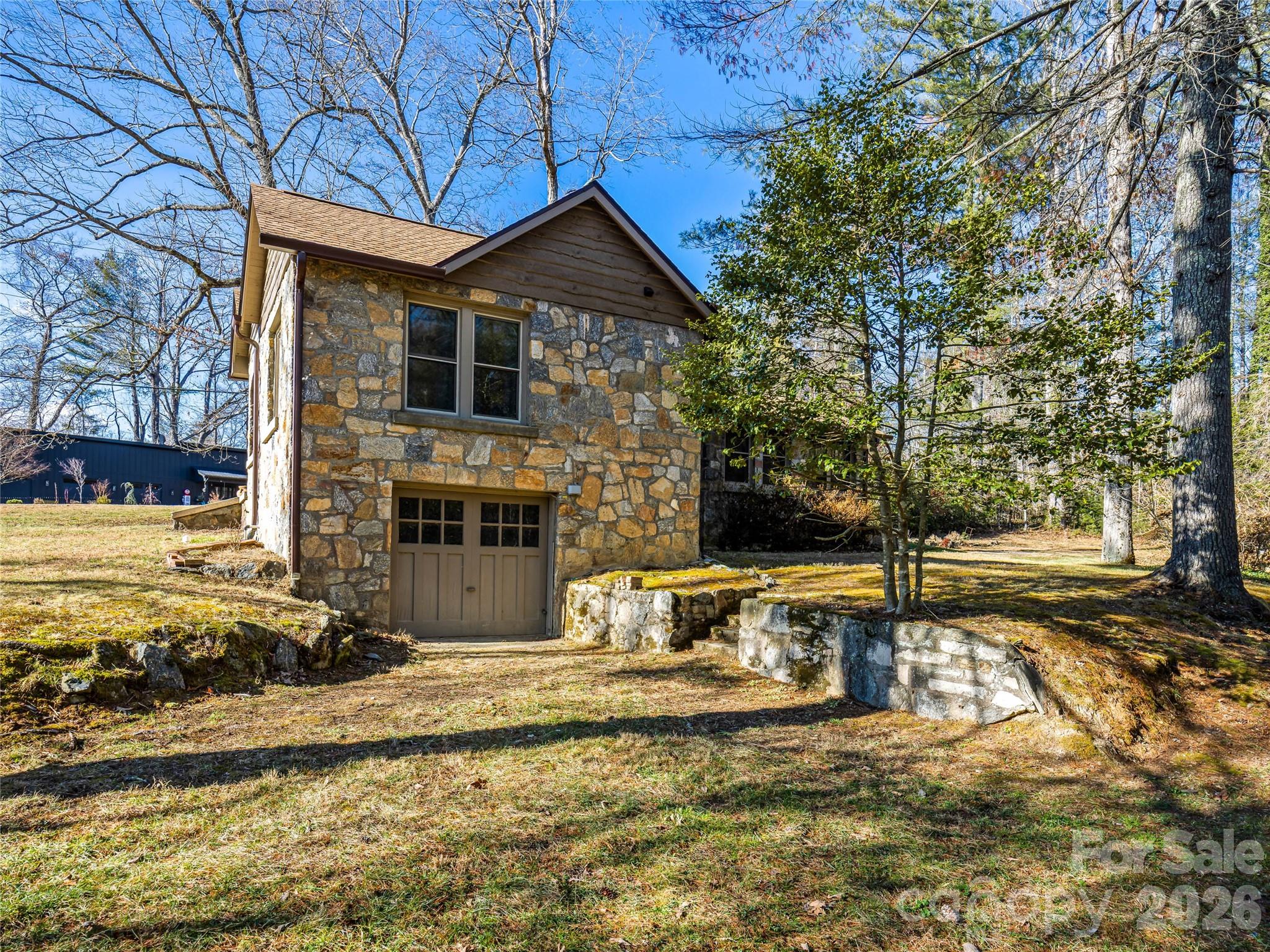 104 Campground Road Hendersonville, NC 28791 - Photo 25 of 32 a front view of a house with a yard