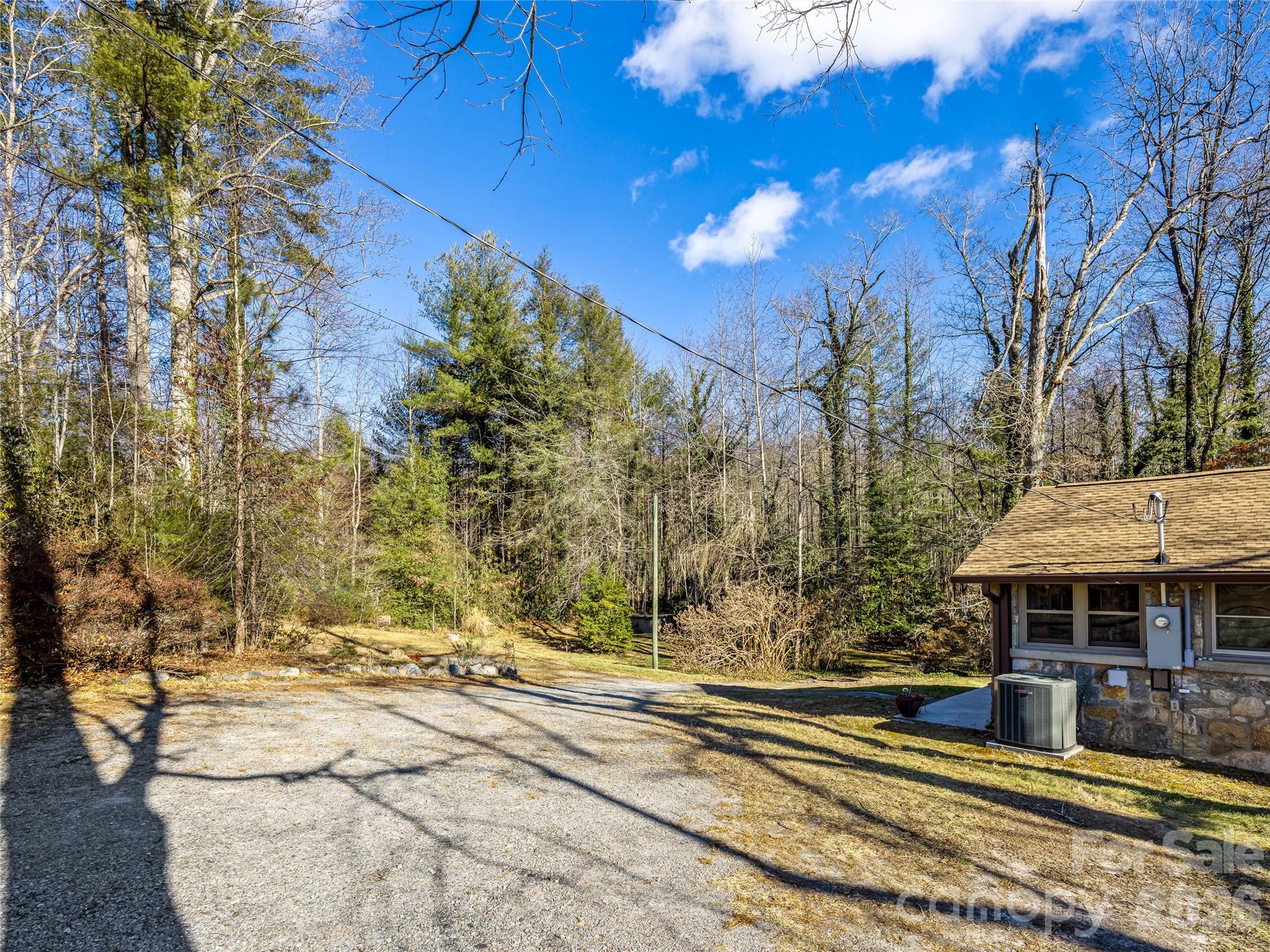 104 Campground Road Hendersonville, NC 28791 - Photo 26 of 32 a view of a house with a yard