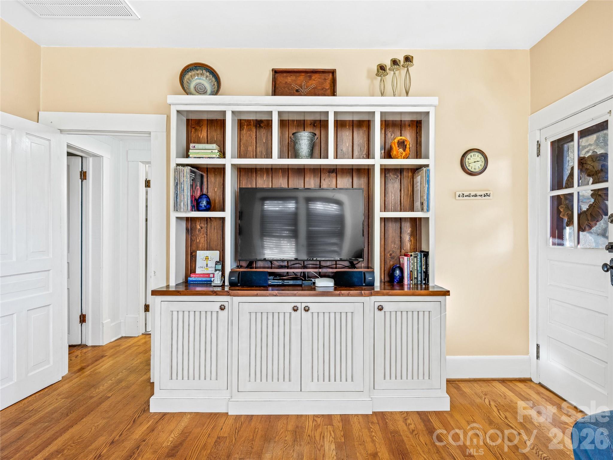 104 Campground Road Hendersonville, NC 28791 - Photo 9 of 32 a view of a living room with a wooden floor