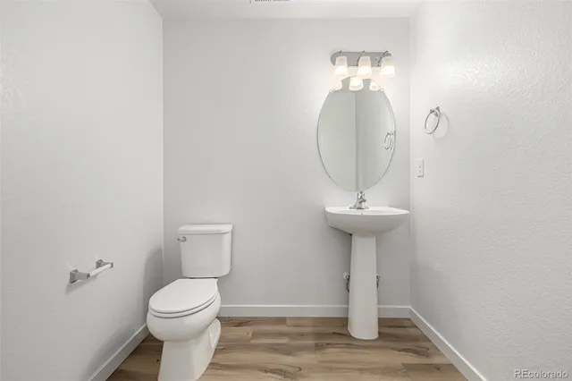 a bathroom with a toilet and a sink