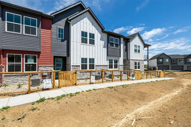 a front view of house with outdoor seating