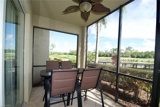 a view of a city from a dining room with large windows