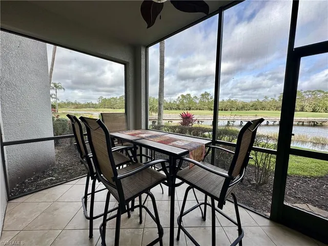 a view of a dining room with furniture and window