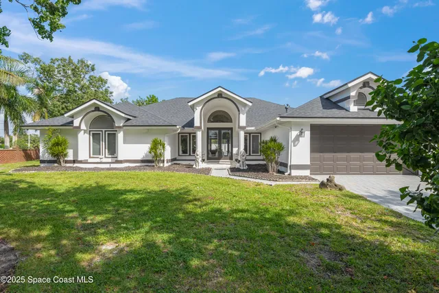 a front view of a house with swimming pool and porch