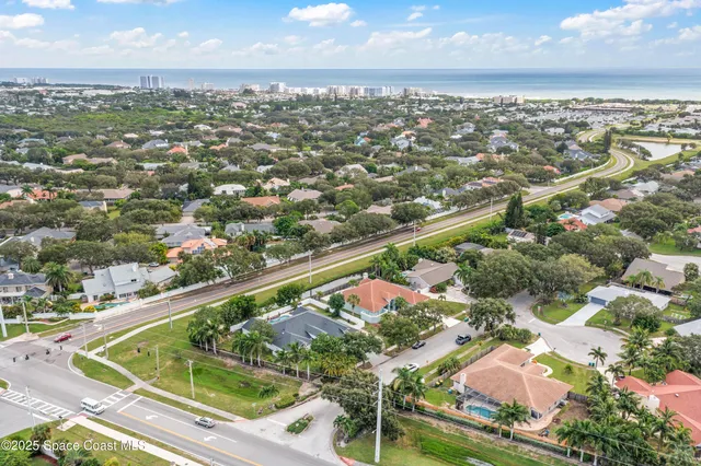 an aerial view of residential houses with outdoor space