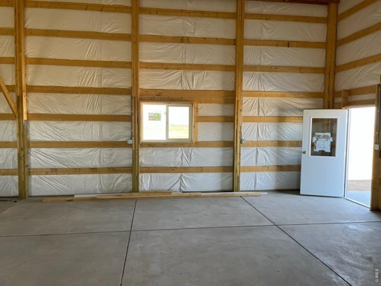 13550 Deter-Winters Road Byers, CO 80103 - Photo 13 of 50 5 operable windows, 2 overhead doors plus the main service door enhance useability and bring in lots of fresh air and natural light into the barn