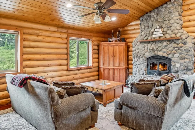 a outdoor living space with furniture and a fireplace