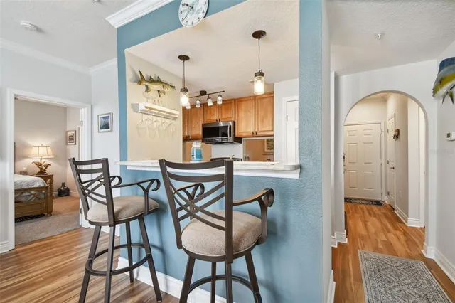a dining room with furniture and wooden floor