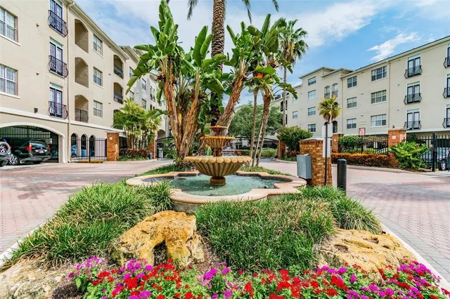 a view of yard with patio and bench