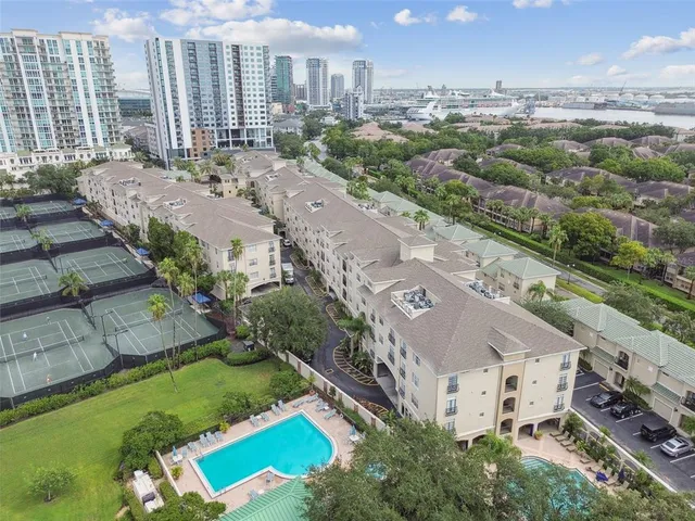 an aerial view of a city with lawn chairs