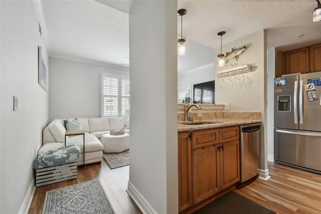 a kitchen with a refrigerator and a sink