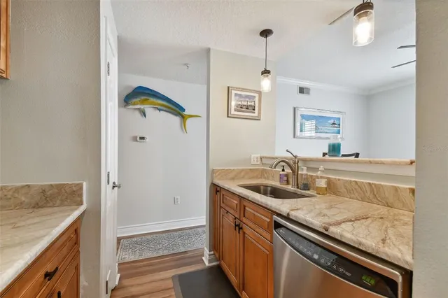 a kitchen with a sink and a refrigerator