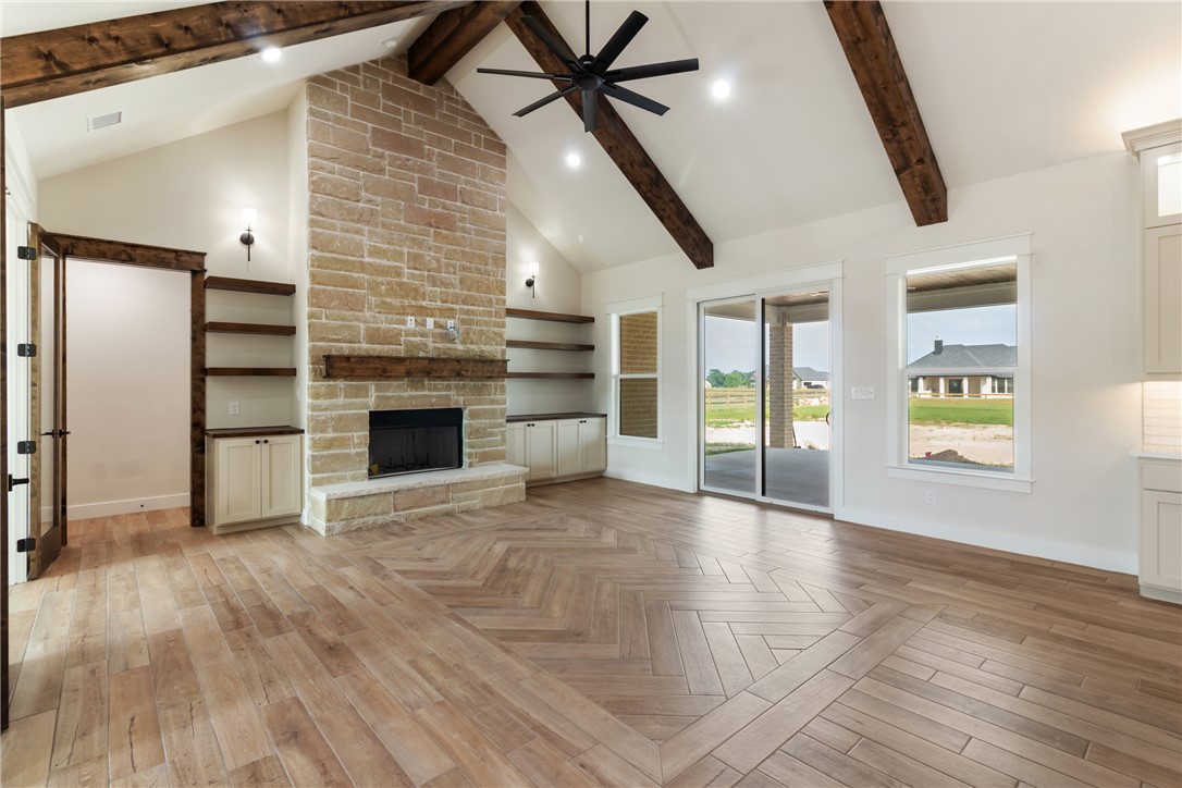 7822 Mathis Crk Drive Bryan, TX 77808 - Photo 6 of 43 a view of an empty room with a fireplace and a window