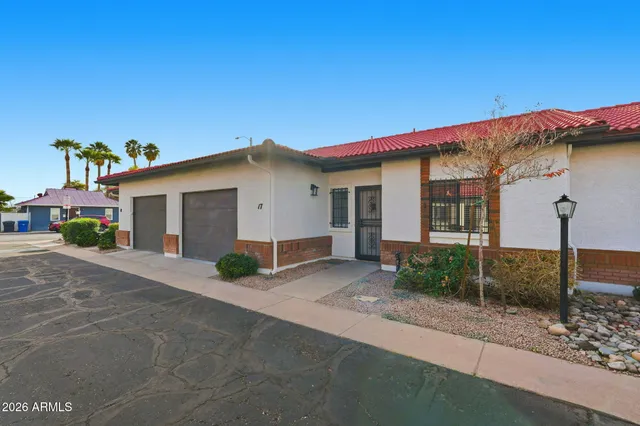 a view of a house with a yard and garage