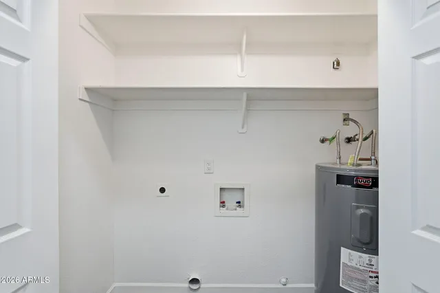 a view of storage and utility room with racks on the wall