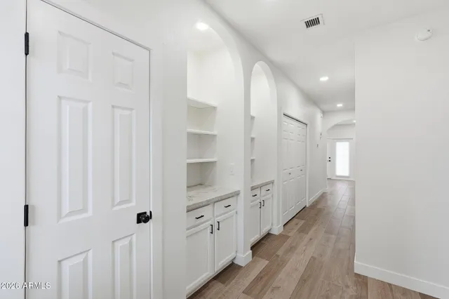 a bathroom with a double vanity sink and mirror