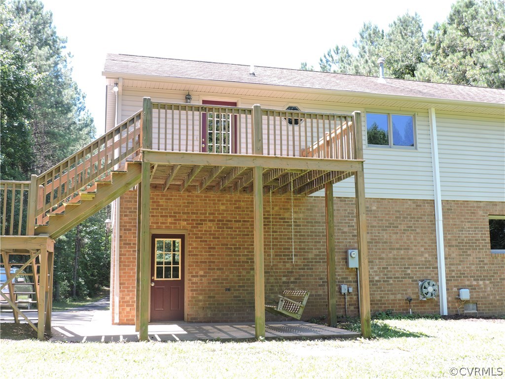 23640 Skinquarter Road Moseley, VA 23120 - Photo 28 of 34 Rear deck off kitchen and patio below.