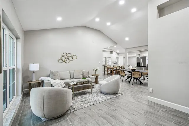 a living room with furniture and a table