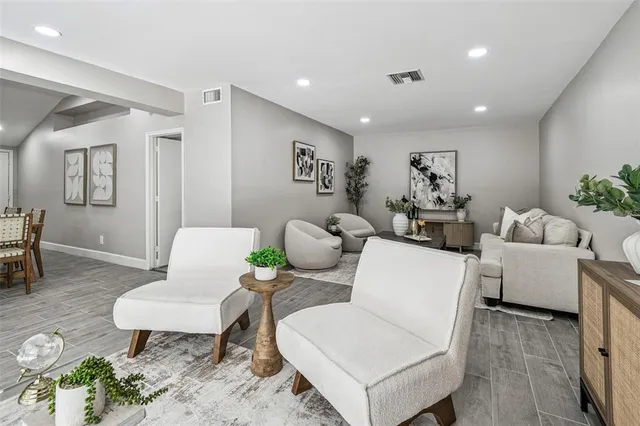 a living room with furniture and a table