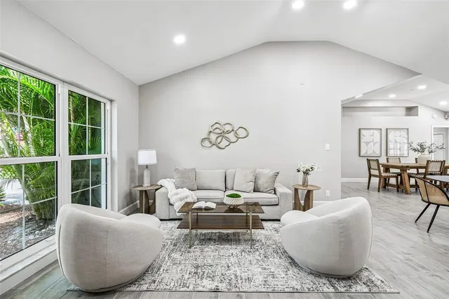 a living room with furniture and a large window