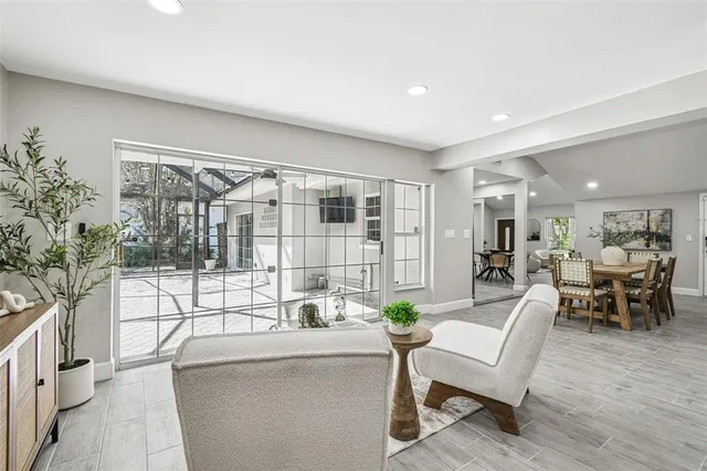 a living room with furniture and a potted plant