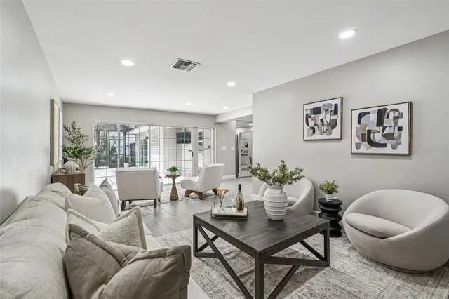 a living room with furniture and a large window
