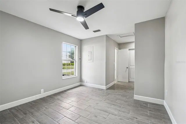 a view of an empty room with a window