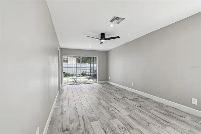 a view of an empty room with a window