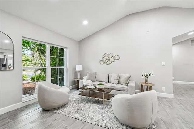 a living room with furniture and a large window