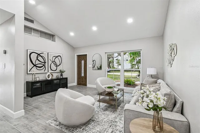 a living room with furniture window and a table