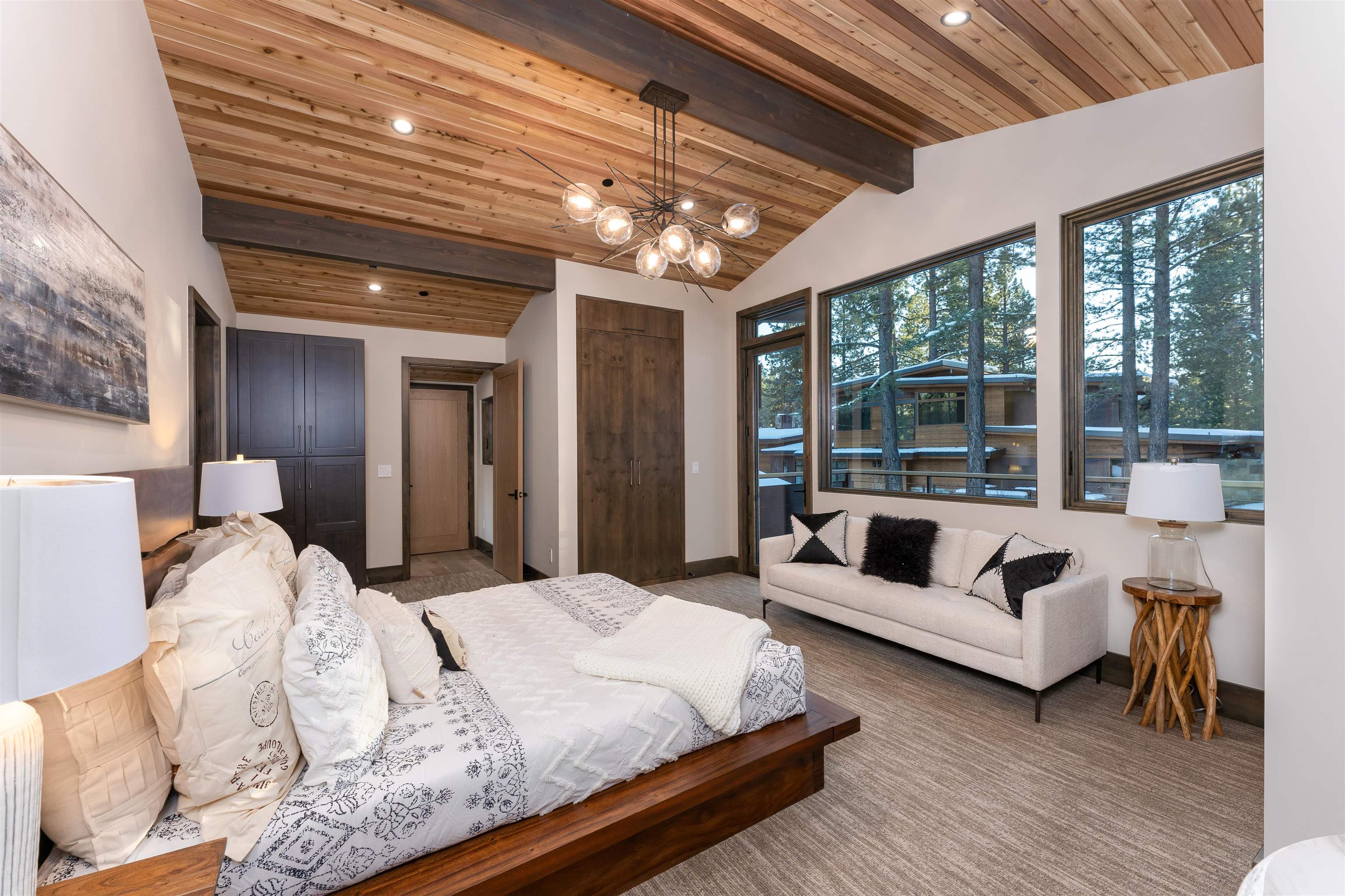13150 Snowshoe Thompson Circle Truckee, CA 96161 - Photo 14 of 21 a spacious bedroom with bed and a large window with balcony view