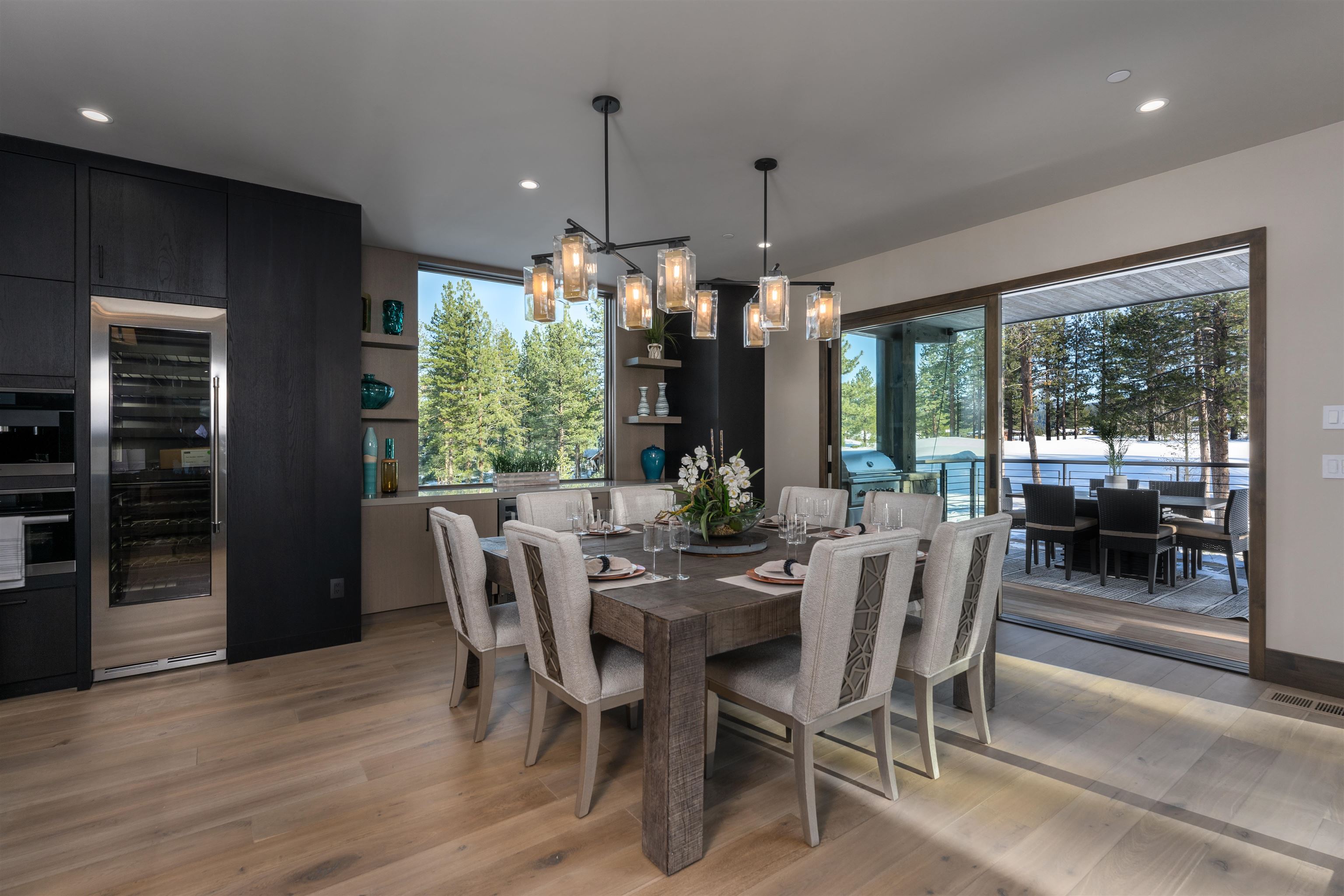 13150 Snowshoe Thompson Circle Truckee, CA 96161 - Photo 8 of 21 a view of a dining room with furniture large windows and wooden floor